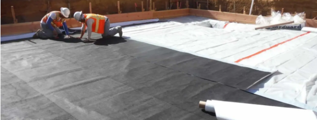 Installing a Moisture Barrier for Concrete Floor Before Laying Finish Materials Installing a Moisture Barrier for Concrete Floor Before Laying Finish Materials